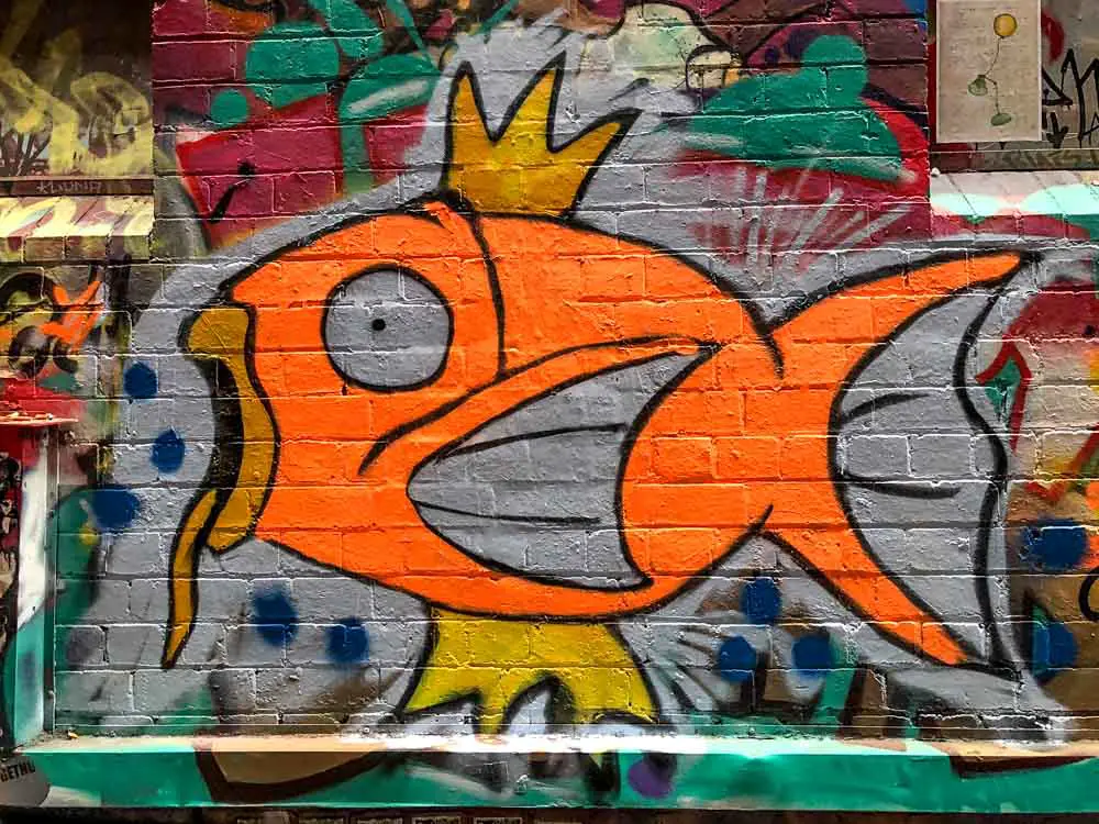 Fish street art in Artists Alley Melbourne. Orange and green fish