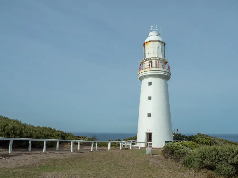 Cape Otway lighthouse on the Great Ocean Road. White lighthouse with walkway and fencing