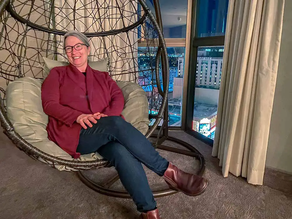 Reno Whitney Peak Hotel lounge. woman sitting in hanging chair